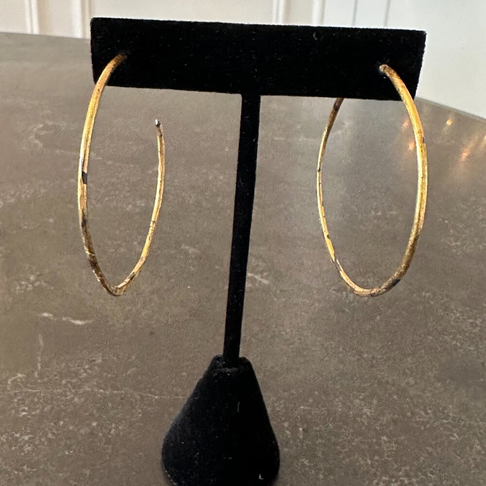 Gold and black hoop earrings
